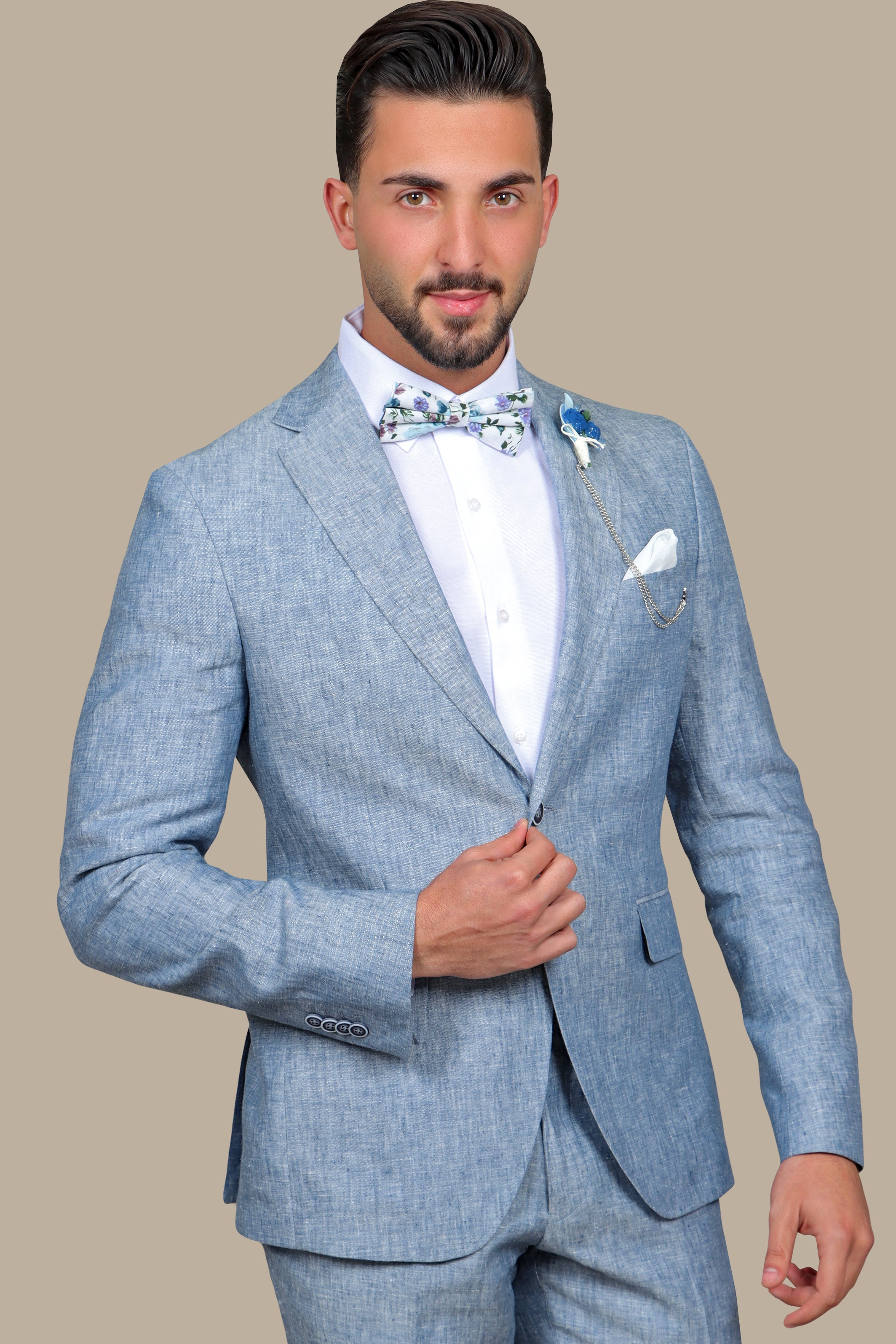 A model wearing a light blue linen suit