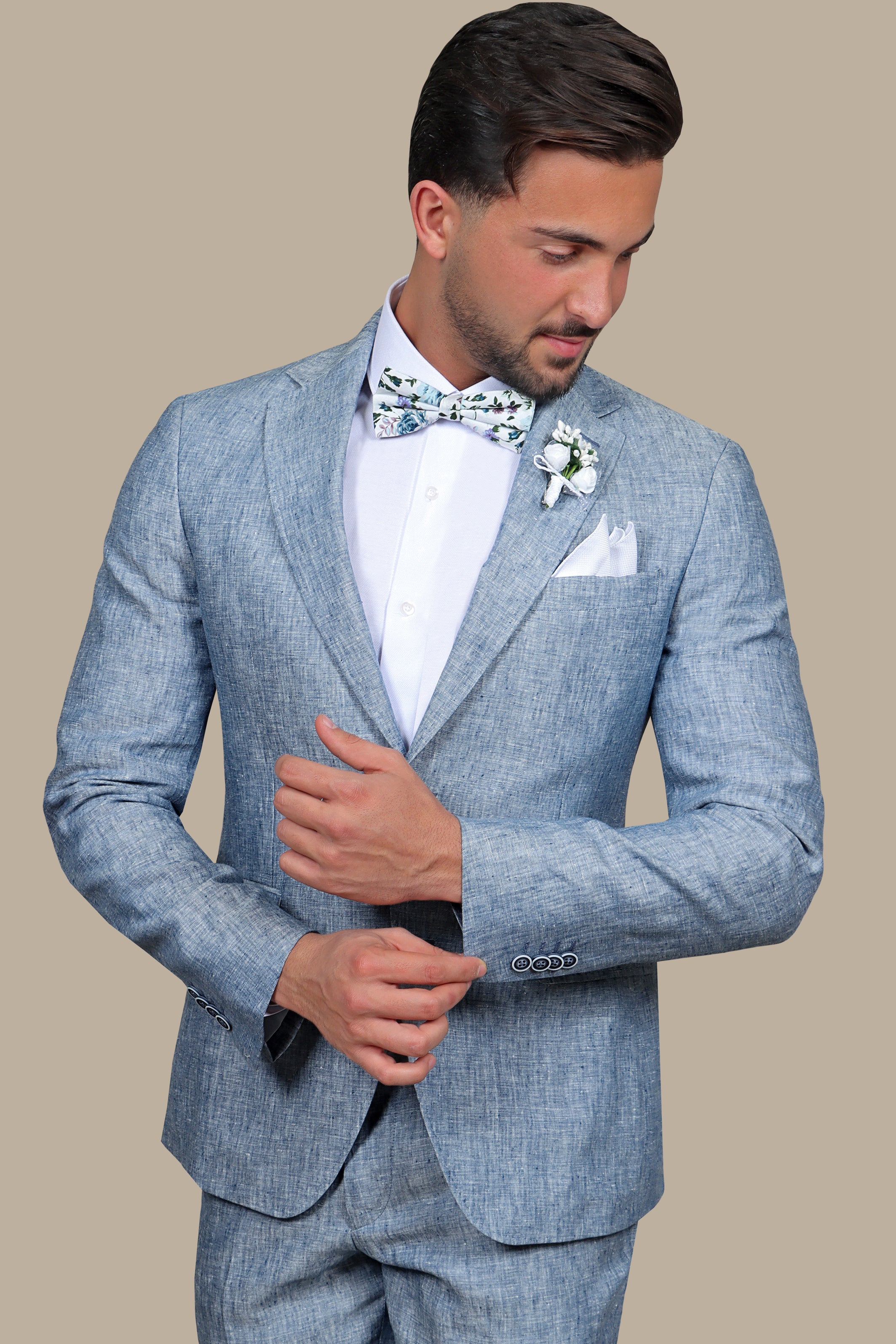 A model wearing a light blue linen suit
