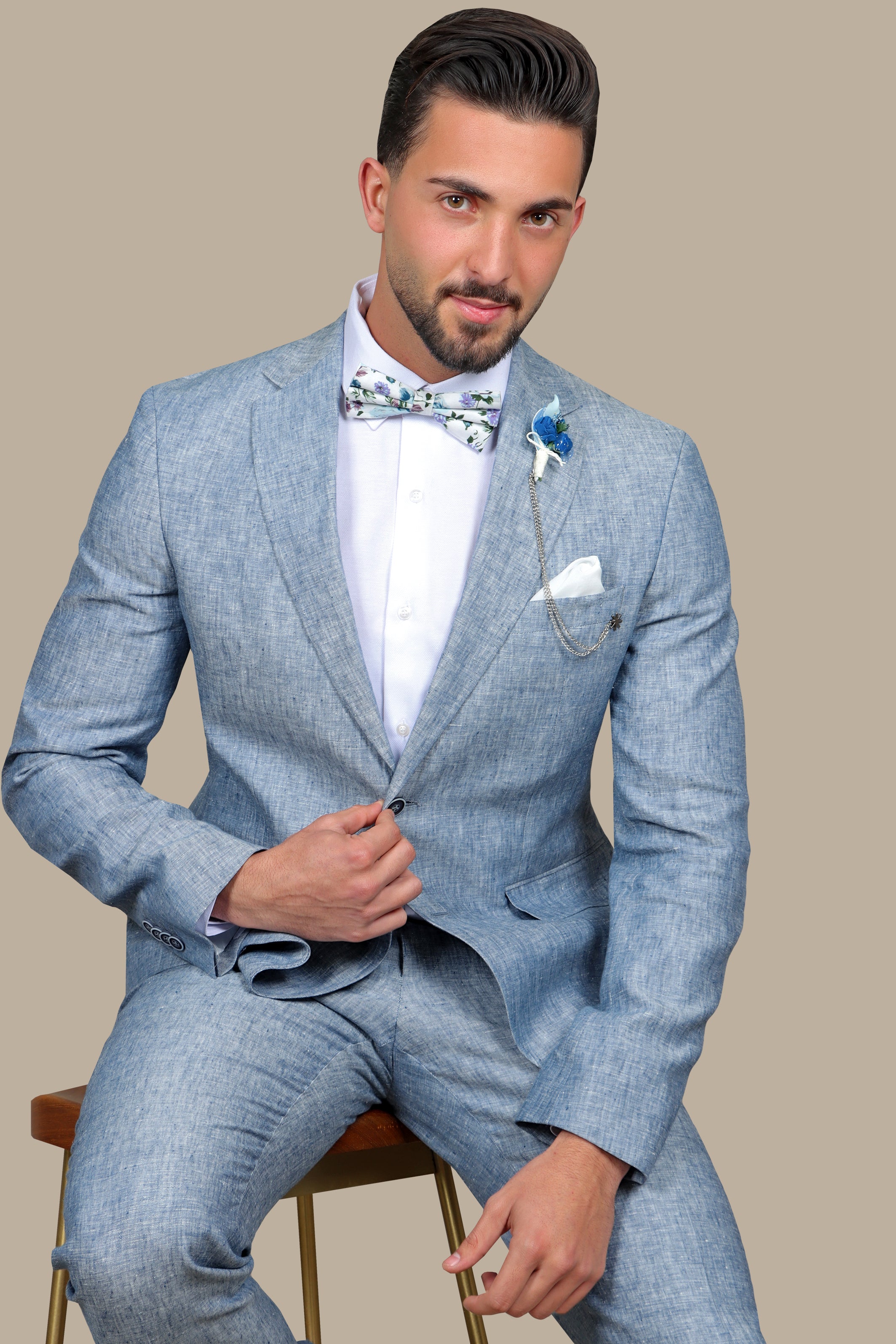 A model wearing a light blue linen suit