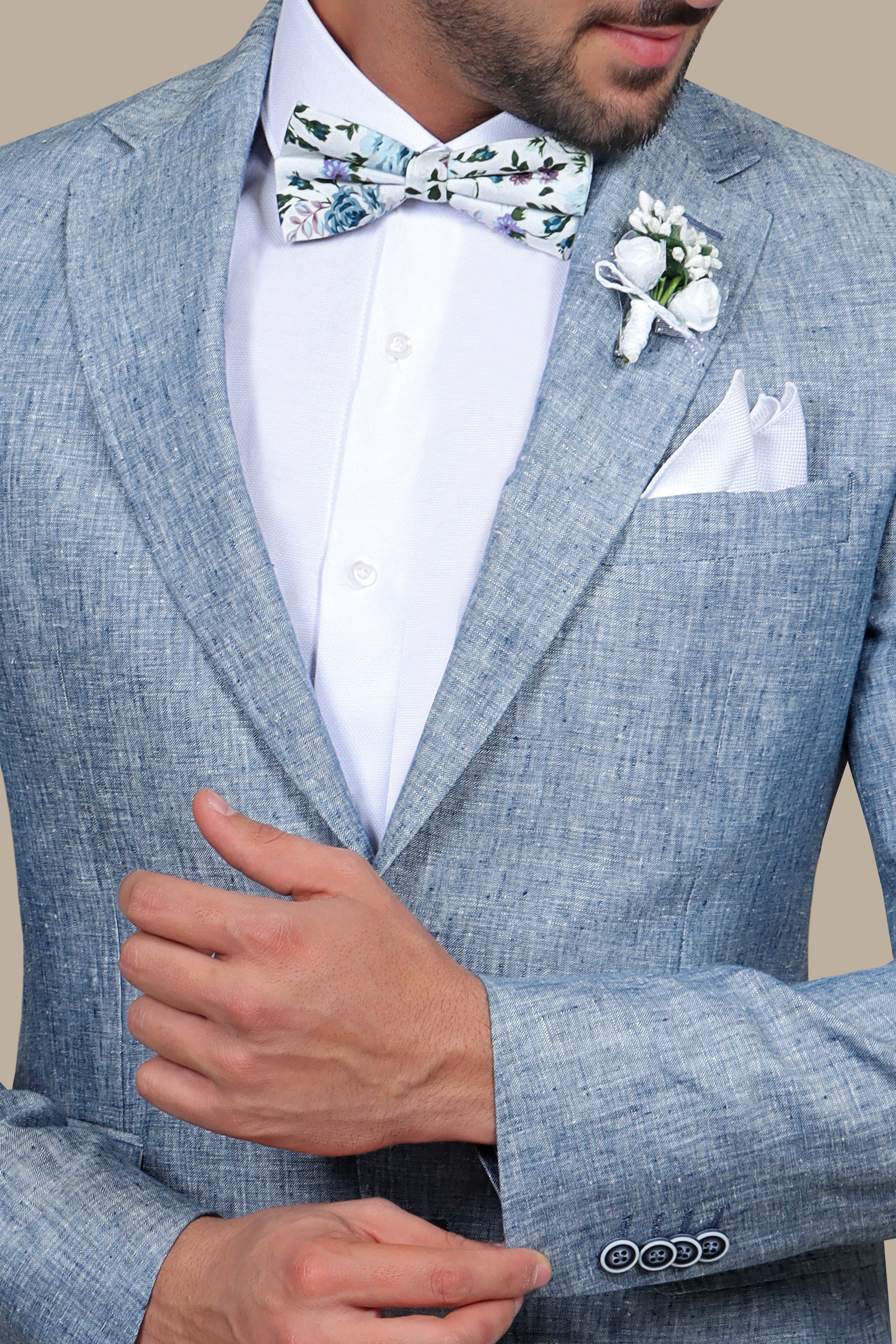 A model wearing a light blue linen suit