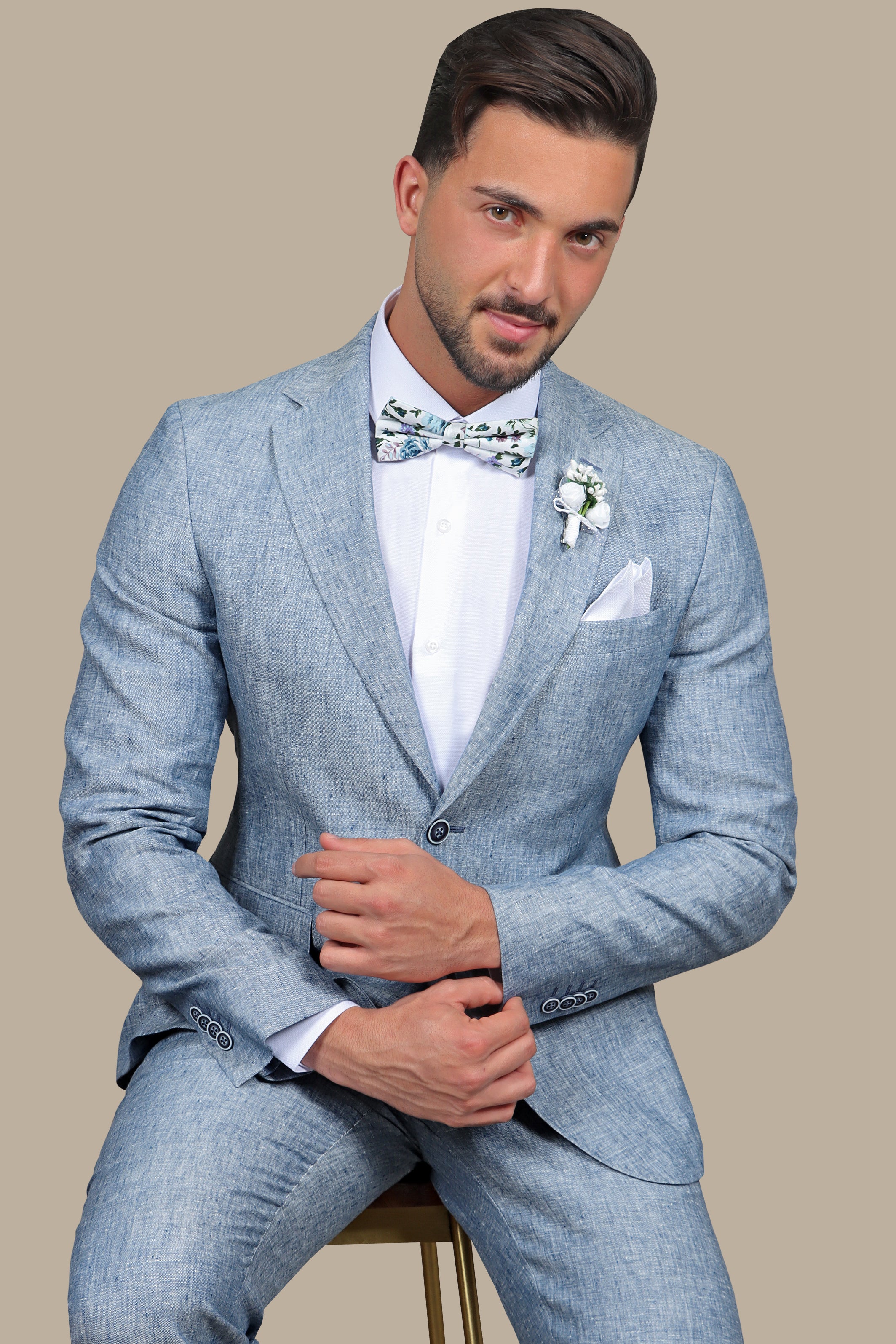 A model wearing a light blue linen suit