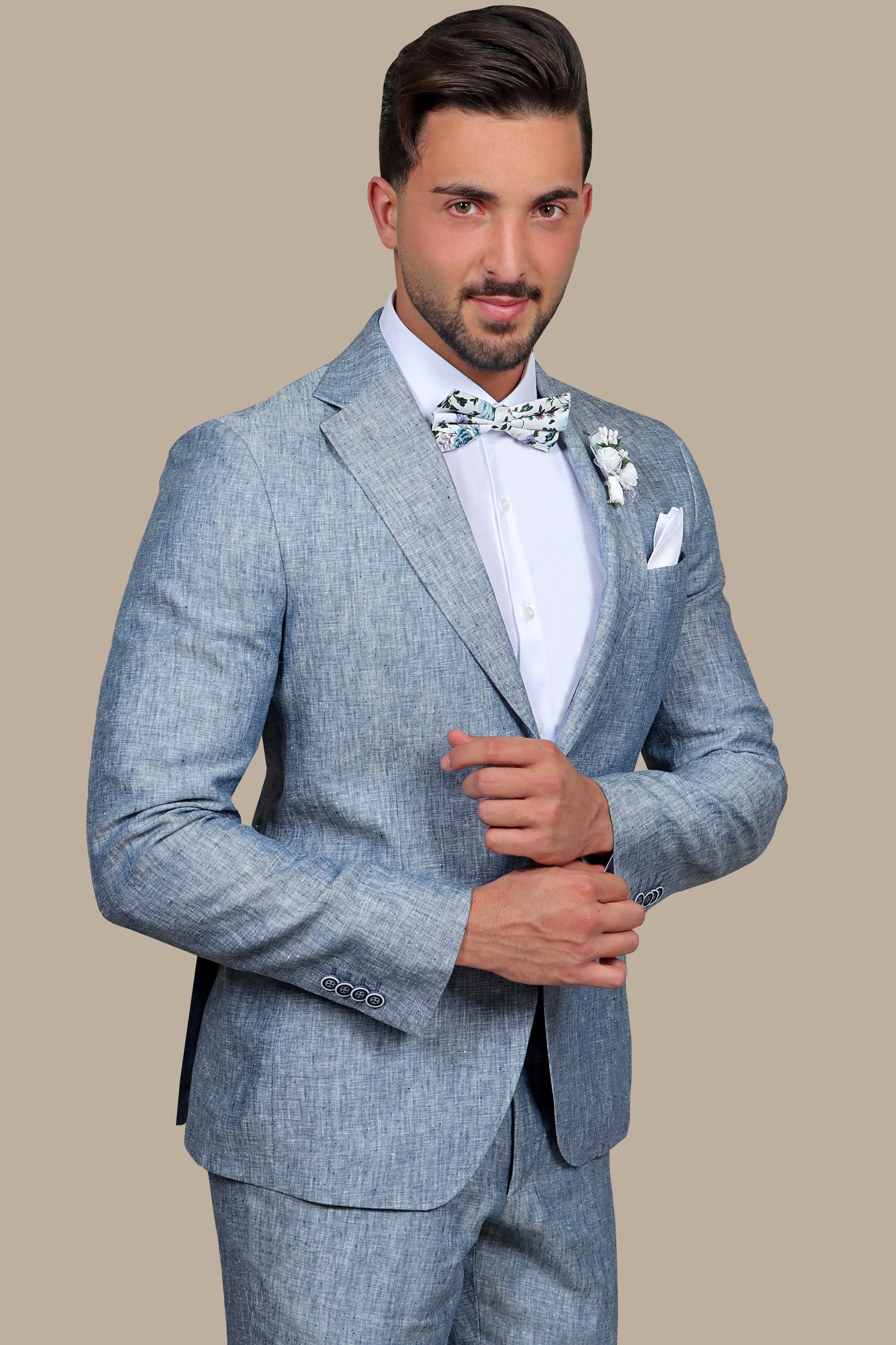 A model wearing a light blue linen suit