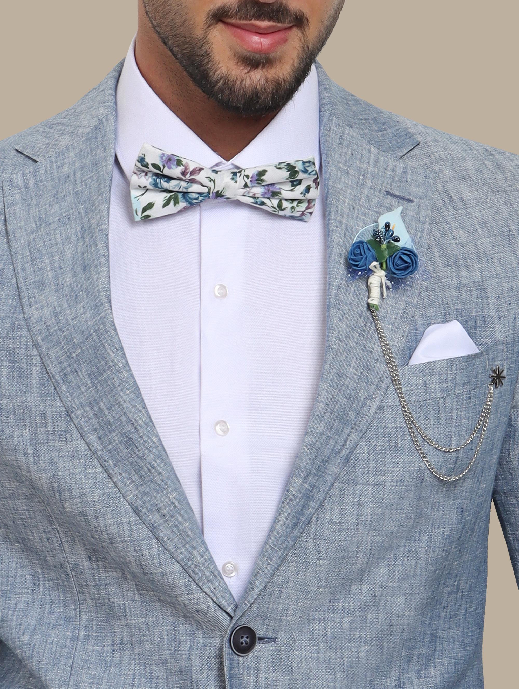 A model wearing a light blue linen suit