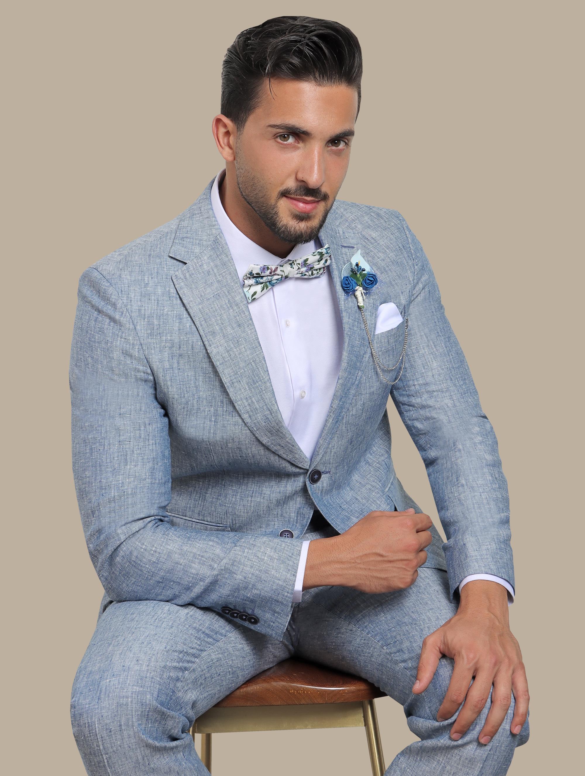 A model wearing a light blue linen suit