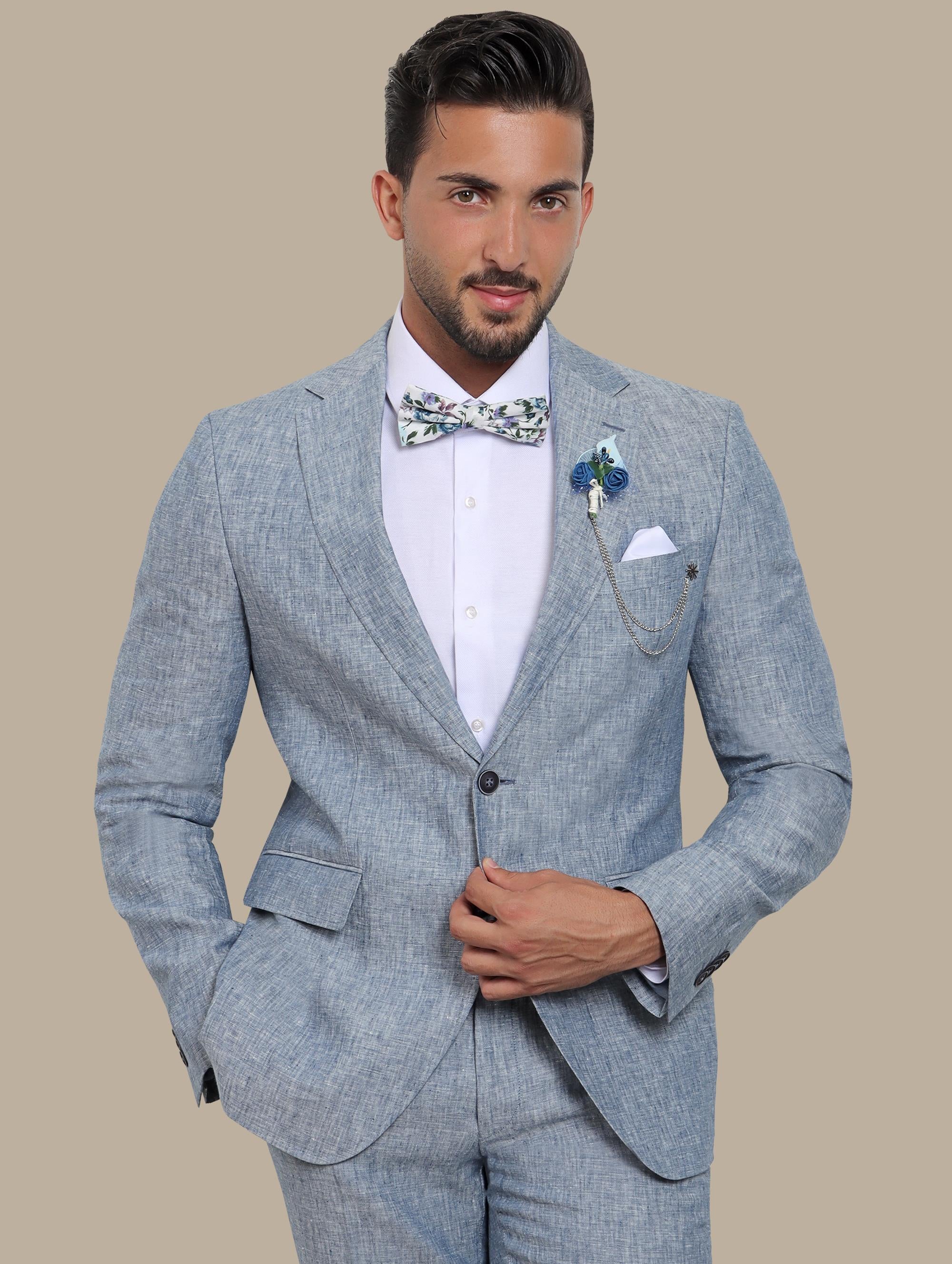 A model wearing a light blue linen suit