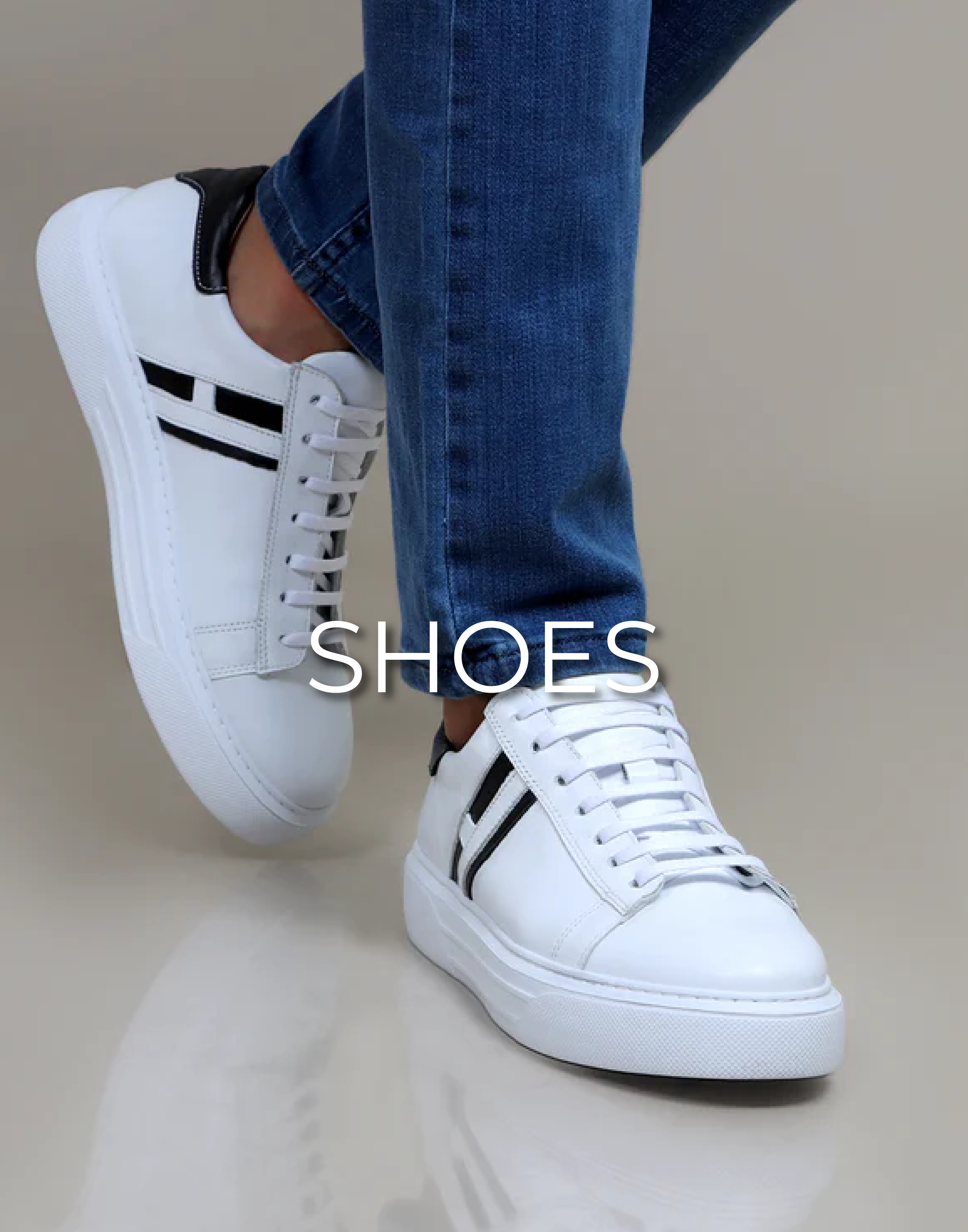 A model wearing a pair of white shoes and small black marks on the shoes and is written on the image shoes